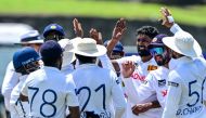 Sri Lanka's Prabath Jayasuriya (third left) celebrates with teammates after the dismissal of New Zealand's Tom Blundell during the third day of the second Test cricket match between Sri Lanka and New Zealand at the Galle International Cricket Stadium in Galle on September 28, 2024. (Photo by Ishara S. Kodikara / AFP)

