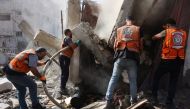 Palestinian civil defence rescue workers battle a fire after an Israeli strike in Gaza City on September 17, 2024, amid the continuing war between Israel and Hamas. (Photo by Omar AL-QATTAA / AFP)
