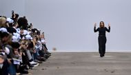 British fashion designer Stella McCartney (C) acknowledges the audience at the end of her Women Ready-to-wear Spring-Summer 2025 collection as part of the Paris Fashion Week, in Paris on September 30, 2024. (Photo by JULIEN DE ROSA / AFP)