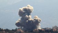 Smoke rises from the site of an Israeli airstrike that targeted the southern Lebanese village of Khiam on September 30, 2024. (Photo by Rabih Daher / AFP)