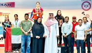 Officials and staff with the winning young athletes during the award ceremony.