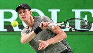 Italy's Jannik Sinner hits a return to Japan's Taro Daniel during their men's singles match at the Shanghai Masters tennis tournament in Shanghai on October 5, 2024. (Photo by Hector Retamal / AFP)