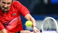 Russia's Daniil Medvedev hits a return to Italy's Matteo Arnaldi during their men's singles match at the Shanghai Masters tennis tournament in Shanghai on October 6, 2024. (Photo by Hector RETAMAL / AFP)
