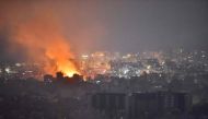 Flames and smoke rise in an area targeted by an Israeli air strike on Beirut's southern suburbs, October 6, 2024. (Photo by Fadel Itani / AFP)