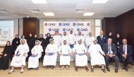 QNB officials along with Qatari graduates during the Induction program.