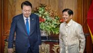 Philippine President Ferdinand Marcos (R) meets with South Korea's President Yoon Suk Yeol at the Malacanang Palace in Manila on October 7, 2024. Photo by Ezra Acayan / POOL / AFP.
