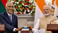 India's Prime Minister Narendra Modi (right) and Maldives President Mohamed Muizzu virtually inaugurate the new runway at Maldives' Hanimadhoo International Airport, during a joint media briefing at the Hyderabad House in New Delhi on October 7, 2024. (Photo by Money Sharma / AFP)