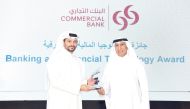 EGM, Chief Wholesale and International Banking Officer at Commercial Bank, Fahad Badar receiving the award from UDST President Dr. Salem Al Naemi.