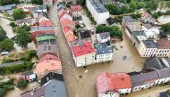 (Files) This aerial photograph taken on September 15, 2024 shows a view of the flooded streets in Glucholazy, southern Poland. (Photo by Sergei Gapon / AFP)