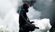 File: A worker sprays insecticide to prevent mosquito breeding at a railway station in Colombo, Sri Lanka, May 13, 2023. (Photo by Ajith Perera/Xinhua)