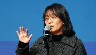 This undated photo released by Yonhap news agency on October 10, 2024 shows South Korean author Han Kang delivering a speech at a lecture in Gwangju. Photo by YONHAP / AFP