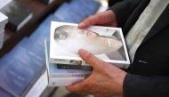 A man holds books by South Korean author Han Kang, who won the 2024 Nobel Prize in Literature, at a bookstore in Seoul on October 11, 2024. Photo by Jung Yeon-je / AFP