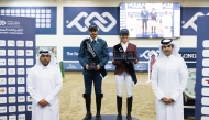 Ambassador of Qatar to the Republic of Azerbaijan, H E Faisal bin Abdullah Hamad Al Hanzab (right) crowned the Big Tour winners of Longines Hathab Round Two at the Qatar Equestrian Centre's indoor arena yesterday.