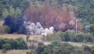 This screen grab taken from video released by the South Korean Defence Ministry and filmed from an undisclosed location in South Korea along the inter-Korean border shows an explosion on a road connecting North and South Korea on October 15, 2024. Photo by Handout / South Korea Defense Ministry / AFP