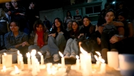 Fans of British singer Liam Payne lit candles next to the hotel where he died in Buenos Aires on October 16, 2024. Photo by Luis ROBAYO / AFP