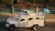 A United Nations Interim Force In Lebanon (UNIFIL) armoured vehicle drives on a road in the southern Lebanese area of Marjeyoun on October 17, 2024. UNIFIL, a mission of about 9,500 troops of various nationalities, was created following Israel's 1978 invasion of Lebanon. (Photo by AFP)