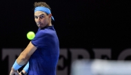 Spain's Rafael Nadal hits a return to Serbia's Novak Djokovic during their third-place tennis match in the 