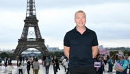 (Files) Britain's former track cyclist Chris Hoy poses for a photo ahead of the opening ceremony of the Paris 2024 Olympic Games in Paris on July 26, 2024, in front of the Eiffel Tower. (Photo by Jonathan Nackstrand / AFP)