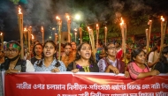 Female students chant slogans during a protest to condemn violence against women in Dhaka on October 22, 2024. (Photo by Salahuddin Ahmed / AFP)