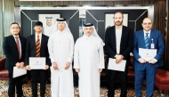 Minister of Environment and Climate Change H E Dr. Abdullah bin Abdulaziz bin Turki Al Subaie with students and officials during the event.