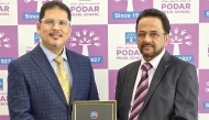 President of Podar Pearl School C. Muhamed Nizar and Principal Dr. Maneesh Mangal with the certificate of the award.