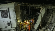 National Disaster Response Force (NDRF) personnel inspect the site for survivors during a search operation after an under-construction building collapsed in Bengaluru on October 22, 2024. Photo by Idrees MOHAMMED / AFP.
