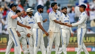 India's Washington Sundar (3R) celebrates with teammates after taking the wicket of New Zealand's Tim Southee in Pune on October 24, 2024. (Photo by Punit Paranjpe / AFP) 