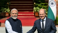 India's Prime Minister Narendra Modi (L) shakes hands with German Chancellor Olaf Scholz before their meeting at the Hyderabad House in New Delhi on October 25, 2024. (Photo by Money SHARMA / AFP)