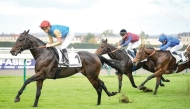 Christophe Soumillon steers Map Of Stars (left) towards the title at Chantilly yesterday.  