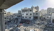 Palestinians inspect the damage after an overnight Israeli airstrike in Beit Lahia the northern Gaza Strip on October 27, 2024. Photo by AFP