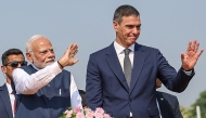 Spanish Prime Minister Pedro Sanchez (R) with his Indian counterpart Narendra Modi waving to crowd during a roadshow following his arrival in Vadodara in India's Gujarat state. Taken and released on October 28, 2024 by the Indian Press Information Bureau (PIB). Photo by PIB / AFP.