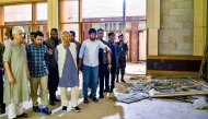 Photo used for demonstration purposes. Handout photograph taken on October 28, 2024 and released by the Press Wing of Bangladesh's Chief Adviser shows the country's interim government Chief Adviser Muhammad Yunus (4L) with Information and Broadcasting adviser Nahid Islam (2L), as they tour the battered Gonobhaban palace, the former official residence of the ousted prime minister Sheikh Hasina in Dhaka. Photo by Press Wing of Bangladesh's Chief Adviser / AFP.