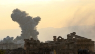 Smoke rises from the site of an Israeli airstrike that targeted an area on the outskirts of the eastern Lebanese city of Baalbeck in the Bekaa valley on October 31, 2024. In the foreground the ancient Roman ruins with the Temple of Bacchus can be seen. (Photo by Nidal Solh / AFP)