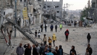 Palestinians check the damage following Israeli strikes in Nuseirat refugee camp in the central Gaza Strip, on November 1, 2024. (Photo by Eyad BABA / AFP)