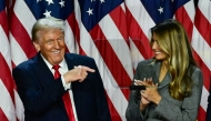 Former US President and Republican presidential candidate Donald Trump points to his wife former US First Lady Melania Trump during an election night event on November 6, 2024. (Photo by Jim Watson / AFP)