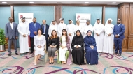 Officials pose for a photo during the training program.