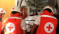 Lebanese Red Cross volunteers transport injured 32-year-old Zainab Khalifeh from the Alaa Addin hospital in the southern town of Sarafand, to be transferred by ambulance to a specialised medical institution in Beirut for the continuation of her treatment, on November 5, 2024. (Photo by Mahmoud Zayyat / AFP)