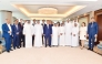 Minister of Investment, Industry and Trade H E Laziz Kudratov; QBA Chairman Sheikh Faisal bin Qassim Al Thani with QBA board members and other officials, yesterday. 