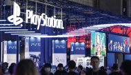 This file photo taken on September 26, 2024 shows visitors walking past the booth for Sony’s PlayStation during the preview day for the annual Tokyo Game Show at Makuhari Messe in Chiba City. (AFP)