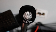 This photograph shows a microphone with the logo of Erena radio Erythree International in Paris, on October 31, 2024. (Photo by Gregoire Campione / AFP)