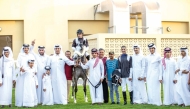 The connections of Medan celebrate after the Hassan bin Ali Hassan Al Matwi-owned six-year-old mare won the Umm Bab Cup.