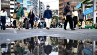 People walk through Shibuya area in Tokyo on November 15, 2024. (Photo by Yuichi YAMAZAKI / AFP)