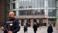 A security member stands guard in front of the Bakirkoy courthouse, on the opening day of Turkey's newborn gang trafficking case trial, in Istanbul, on November 18, 2024. (Photo by KEMAL ASLAN / AFP)
