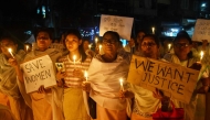 Women holding placards and candles take part in a demonstration in Guwahati on November 18, 2024, to condemn the alleged killing of women and children by militants in the Jiribam district of India's violence-hit northeastern state of Manipur. (Photo by Biju Boro / AFP)
 