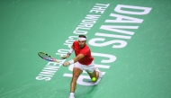 Spain's Rafael Nadal returns a shot to Netherlands' Botic van de Zandschulp in the quarter-final singles match between Netherlands and Spain during the Davis Cup Finals at the Palacio de Deportes Jose Maria Martin Carpena arena in Malaga, southern Spain, on November 19, 2024. (Photo by Jorge Guerrero / AFP)
