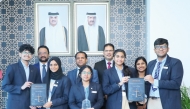 Students and school officials with the award.