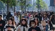 Pedestrians walk down the high-street shopping area of the Ginza district in central Tokyo on November 22, 2024. Photo by Richard A. Brooks / AFP