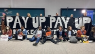 Activists hold a silent protest inside the COP29 venue to demand that rich nations provide climate finance to developing countries, during the United Nations Climate Change Conference (COP29) in Baku on November 16, 2024. Photo by Laurent THOMET / AFP.