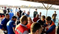 This handout picture released by the Egyptian State Information Service shows first-responders tending to a man on a stretcher in the Red Sea harbour town of Marsa Alam on November 25, 2024. Egyptian authorities said more than a dozen people including foreigners were still missing after a tourist yacht capsized in the Red Sea on November 25, with 28 others rescued. (Photo by EGYPTIAN SIS / AFP) 