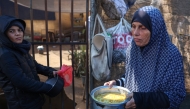 A displaced Palestinian woman carries food in container at a distribution centre in Deir el-Balah in the central Gaza Strip on November 26, 2024. Photo by BASHAR TALEB / AFP.